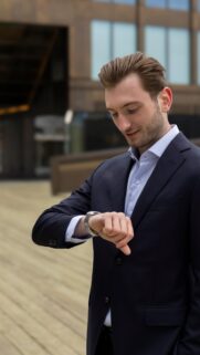 Professional Business Man Checking Time Smart Casual Office Suit Wallpaper