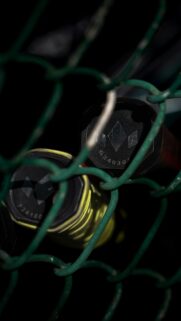 Tennis Racquet Handles Behind Chain Link Fence 4K Wallpaper