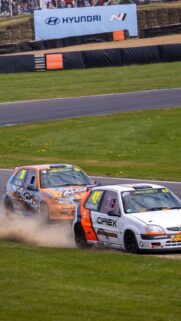 Action Packed Citroen Saxo Racing Car Battle Mobile Wallpaper