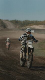 High-Speed Dirt Bike Racing Action Mobile Wallpaper