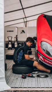 Racing Pit Crew Mechanic Working on Sportscar HD Mobile Wallpaper