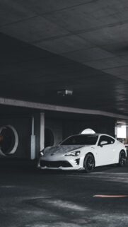White Toyota 86 Sports Car in Modern Parking Garage Wallpaper
