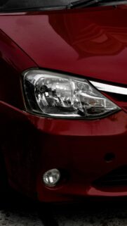 Red Car Headlight Close-up Automotive Mobile Wallpaper