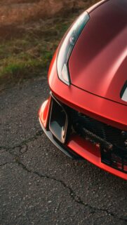 Close-Up Red Sports Car Front Bumper Design 4K Mobile Wallpaper