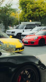 Stunning Luxury Sports Cars Lineup Red and Yellow Porsche Wallpaper