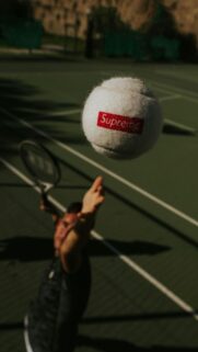Supreme Tennis Ball Action Shot Mobile Phone Wallpaper