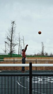 Dunking Basketball Player Outdoor Court Sky Mobile Wallpaper
