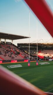 Rugby Stadium Pitch Field View at Sunset Phone Wallpaper