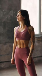 Fit Woman with Floral Tattoos Fitness Aesthetic Mobile Wallpaper