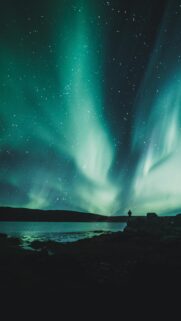 Stunning Aurora Borealis Night Sky with Silhouette Mobile Wallpaper