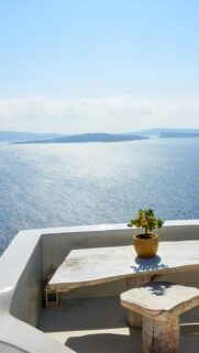 Santorini Sea View with Potted Orange Tree Phone Wallpaper