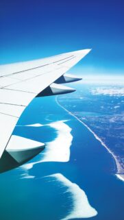 Stunning Aerial View from Airplane Window Blue Ocean Wallpaper
