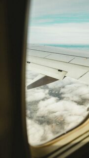 Stunning Airplane Window View Over Clouds Mobile Wallpaper