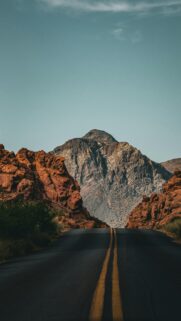 Desert Road and Dramatic Mountain Peak Phone Wallpaper