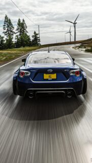 Subaru BRZ Widebody Sportscar Racing Down Rural Highway Wallpaper