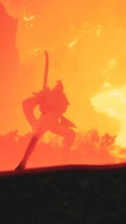Fiery Warrior Silhouette Against Blazing Sunset Mobile Wallpaper