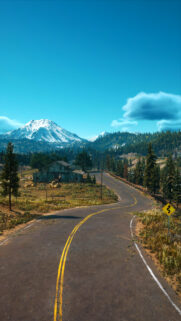 Scenic Winding Mountain Road Landscape with Snow Capped Peaks Phone Wallpaper