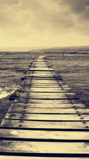 Vintage Wooden Pier Extending Into Ocean Seascape Mobile Wallpaper