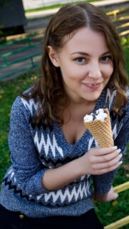 Beautiful Young Woman Eating Ice Cream Outdoor Portrait Mobile Wallpaper