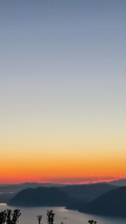 Stunning Sunset Sky Over Silhouetted Mountains Mobile Wallpaper