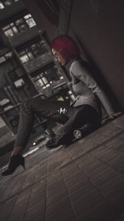 Cyberpunk Girl Sitting in Dark Urban Alley Mobile Wallpaper