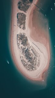 Stunning Aerial View of Coastal Sandbar and Deep Blue Ocean Wallpaper