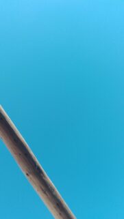 Minimalist Wooden Beam Against Bright Clear Blue Sky Wallpaper