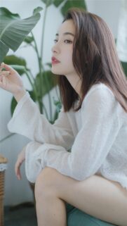 Stunning Asian Woman in White Sweater Minimalist Portrait Wallpaper