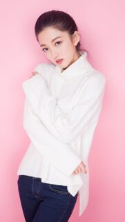 Beautiful Young Asian Woman in White Turtleneck Sweater on Pink Background Wallpaper