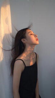 Stunning Golden Hour Portrait of a Young Woman with Soft Sunset Lighting Wallpaper