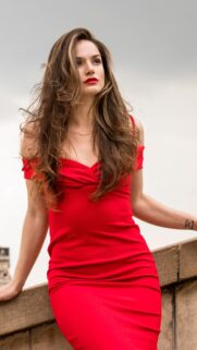 Stunning Woman in Red Dress Elegant Portrait Mobile Wallpaper