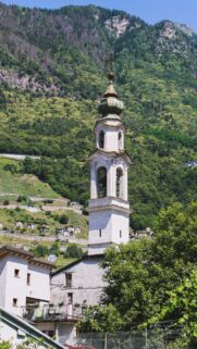 Stunning Alpine Church Tower Wallpaper with Lush Green Mountain Backdrop