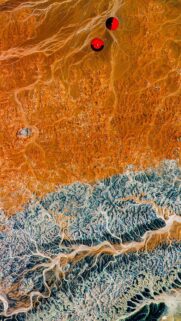 Stunning Aerial Satellite View of Desert Landscapes with Red Circles Wallpaper