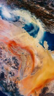 Breathtaking Satellite View of Desert Sandstorm and Ocean Landscape Wallpaper