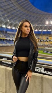 Stunning Woman in Leather Outfit at Stadium Sports Arena Wallpaper