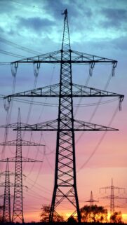 Stunning Electricity Pylon Silhouette Against a Beautiful Sunset Sky Wallpaper
