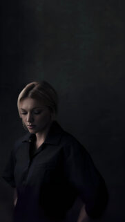Moody Portrait of a Blonde Woman in Black Shirt Mobile Wallpaper