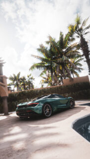 Stunning Green McLaren Supercar by a Tropical Poolside Wallpaper