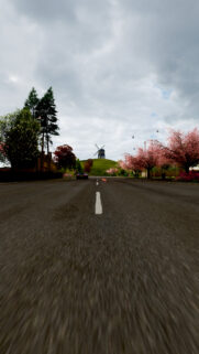 Scenic Road Trip with Windmill and Cherry Blossoms Mobile Wallpaper