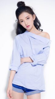 Beautiful Young Asian Woman in Light Blue Off-Shoulder Shirt Portrait Wallpaper