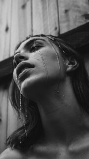 Stunning Black and White Portrait of a Woman with Water Drops Aesthetic Wallpaper