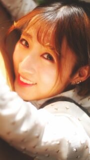 Stunning Close Up Portrait of Beautiful Asian Woman with Golden Sunlight Mobile Wallpaper