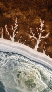 Stunning Aerial View of Fractal River Deltas and Frozen Coastline Wallpaper