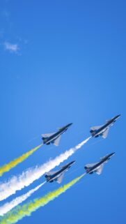 Stunning Fighter Jet Air Show Formation wallpaper with Vibrant Colorful Smoke Trails