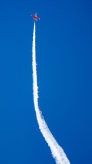 Stunning Red Aerobatic Jet Plane Leaving White Smoke Trail Wallpaper