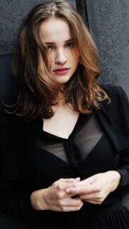 Stunning Portrait of a Beautiful Young Woman in Black Outfit Mobile Wallpaper