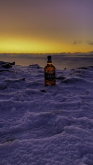 Ballantine’s Hard Fired Whiskey on Snowy Mountain Sunset Wallpaper
