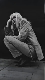 Chic Blonde Woman in Pinstripe Suit Black and White Aesthetic Wallpaper