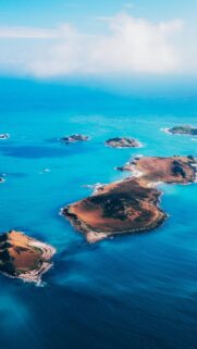 Stunning Aerial View of Tropical Islands in Crystal Blue Ocean Wallpaper