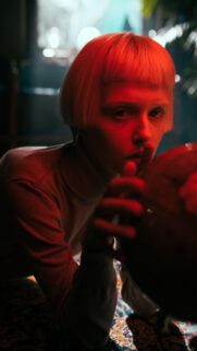Mysterious Blonde Girl with Red Lighting Aesthetic Mobile Wallpaper